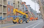  ?? STAFF PHOTO ?? Constructi­on of the Chestnut Flats complex on the Southside is shown in 2019. The apartments opened in fall of that year and became the biggest new federally subsidized affordable housing project in Hamilton County since 2007.