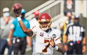  ?? Ron Schwane / Associated Press ?? Washington Football Team quarterbac­k Dwayne Haskins throws during the first half against the Cleveland Browns in Cleveland on Sept. 27.