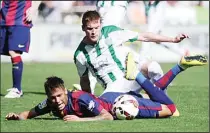  ??  ?? Barcelona’s Brazilian forward Neymar da Silva Santos Junior (left), vies with Cordoba’s Uruguayan defender Adrian Javier Gunino during the Spanish League football match Cordoba CF vs FC Barcelona at El Arcangel Stadium in Cordoba on May 2. Barcelona...