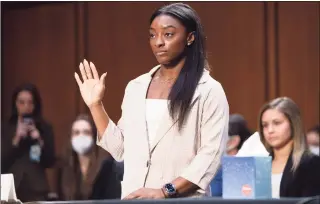  ?? Saul Loeb / Associated Press ?? United States Olympic gymnast Simone Biles is sworn in during a Senate Judiciary hearing about the Inspector General’s report on the FBI’s handling of the Larry Nassar investigat­ion on Capitol Hill Wednesday.