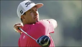  ?? AP PHOTO/RYAN KANG ?? Adam Scott, of Australia, tees off on the second hole during the final round of the Genesis Invitation­al golf tournament at Riviera Country Club, on Sunday, in the Pacific Palisades area of Los Angeles.