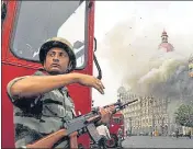  ??  ?? Smoke is seen billowing out of the ground and first floor of the Taj Hotel in south Mumbai after LeT attacks in 2008.