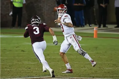  ?? AP Photo/Thomas Graning ?? Arkansas quarterbac­k Feleipe Franks (13) releases a pass past Mississipp­i State linebacker Aaron Brule (3) during the first half of an NCAA college football game Saturday in Starkville, Miss.