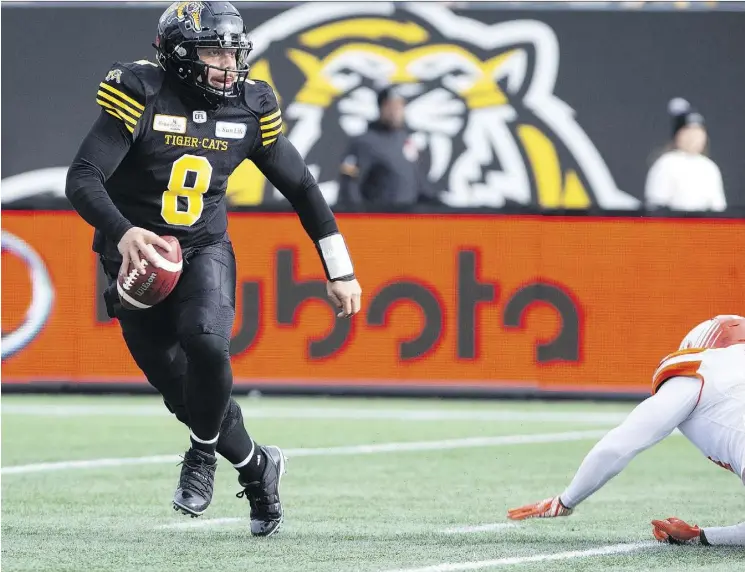  ?? PETER POWER/THE CANADIAN PRESS ?? Hamilton Tiger-Cats quarterbac­k Jeremiah Masoli was near perfect Sunday in a 48-8 East Division semifinal win over the B.C. Lions at Tim Hortons Field.