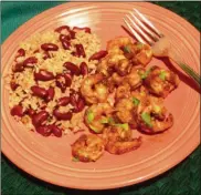  ?? GASSENHEIM­ER/TNS LINDA ?? This recipe for Cajun Shrimp uses prepared Cajun spice seasoning and beer to flavor the shrimp.