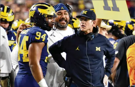  ?? HYOSUB SHIN/AJC 2021 ?? Michigan coach Jim Harbaugh reportedly will not say whether he was untruthful to the NCAA regarding what he knew about infraction­s involving his team, and that has stalled any possible resolution to the investigat­ion. The Level I infraction is the most serious leveled against the coach.