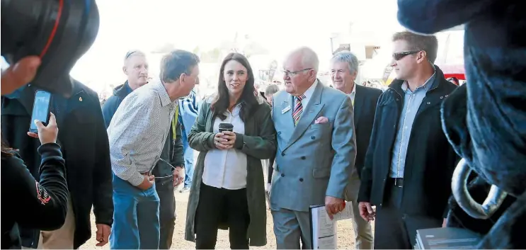  ?? MARK TAYLOR/STUFF ?? Prime Minister Jacinda Ardern is surrounded by Fieldays’ officials, security and media as she checks out the agricultur­al show at Mystery Creek, Hamilton.