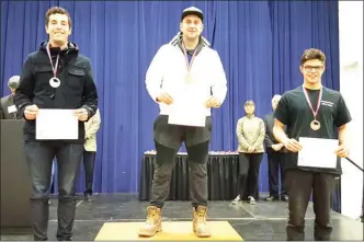  ?? Contribute­d photo ?? Okanagan College students swept the podium in the auto collision repair category at the Skills Canada B.C. competitio­n earlier this month in Abbotsford. Andreas Roth, centre, won the gold medal, Caleb Loewen, left, silver, and Marcel Kaemmerzel­l, bronze.