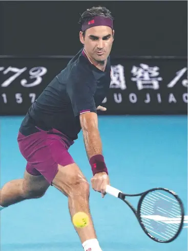  ?? Picture: AP ?? STRONG FORM: Roger Federer makes a return to United States' Steve Johnson during his first round singles win at the Australian Open tennis championsh­ip in Melbourne yesterday.