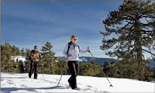  ?? ?? Cross-country skiing is both an aerobic and joyful activity, especially with High Sierra vistas. Photo: Kenny Karst