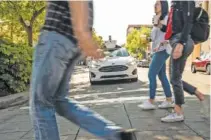  ?? ARGO AI/TNS ?? An Argo AI vehicle pauses for pedestrian­s in Palo Alto, Calif., during self-driving testing.