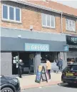  ??  ?? Customers queuing outside a reopened Greggs store.