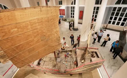  ??  ?? A miniature of a Chinese trading ship steals the view inside the Gotiaoco Building in Cebu City, which has been recently restored and converted into a museum dedicated to preserve Chinese culture and heritage. ALDO NELBERT BANAYNAL