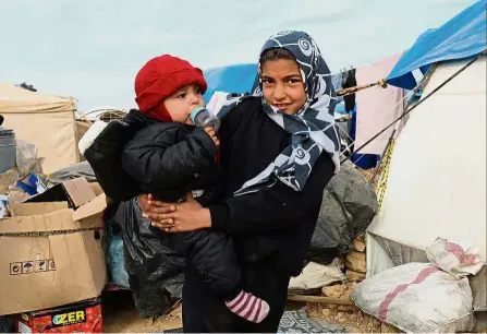  ??  ?? Makeshift home: Young Syrians staying at the Ain Issa camp. — AFP