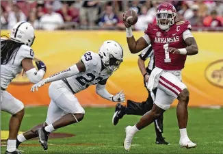  ?? CHRIS O’MEARA/ASSOCIATED PRESS ?? Arkansas quarterbac­k KJ Jefferson had 110 rushing yards and threw for 90 more. Jefferson ran 20 times while completing 14 of 19 passes for the Razorbacks (9-4).