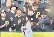  ?? GENE J. PUSKAR — THE ASSOCIATED PRESS ?? Giants left fielder Gregor Blanco leaps for but cannot come up with a two-run home run by the Pirates’ Starling Marte in the first inning Friday.