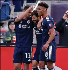  ?? STUART CAHILL / HERALD STAFF FILE ?? COMING TOGETHER: Revolution midfielder Carles Gil, middle, celebrates a goal with Sebastian Lletget, left, and Brandon Bye against FC Dallas on March 5.