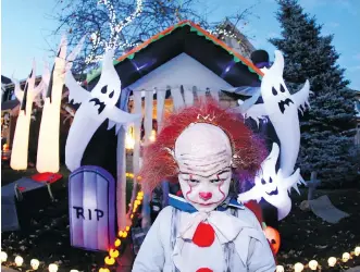  ?? JIM WELLS ?? Baqir Manhem, 6, dressed as a clown Wednesday night while trick-or-treating on Crescent Road N.W.