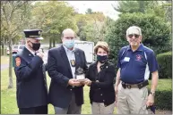  ?? John Mastracchi­o / Contribute­d photo ?? The Glenville Volunteer Fire Company presents its annual David. N. Theis Award for Community Service in memory of Kerrin Coyle, Theis’ longtime partner. Coyle’s friend Jack Kriskey accepted on her behalf. From left, Chief of Police James Heavey, Kriskey, state Rep. Livvy Floren and company President Sandy Kornberg attend the ceremony.