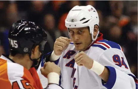  ?? MATT SLOCUM/THE ASSOCIATED PRESS FILE PHOTO ?? New York Rangers enforcer Derek Boogaard, right, died of an accidental drug and alcohol overdose in 2011, five months after a concussion ended his hockey career. A posthumous examinatio­n of his brain found he suffered from chronic traumatic...