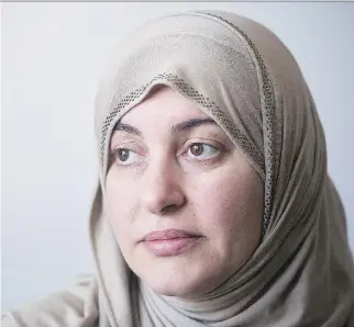  ?? GRAHAM HUGHES /THE CANADIAN PRESS ?? Rania El-Alloul, who was refused her day in court because she was wearing a hijab, says money raised for her through a crowdfundi­ng campaign should go to rights causes.