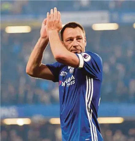  ?? REUTERS PIC ?? Chelsea's John Terry applauds the fans after the match against Watford on Monday. Terry scored the opening goal in Chelsea’s 4-3 win.