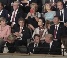  ?? KAY NIETFELD — POOL PHOTO VIA AP ?? Leaders, including German Chancellor Angela Merkel, left, and their partners attend a concert at the Elbphilhar­monie concert hall on the first day of the G-20 summit in Hamburg, Germany on Friday.