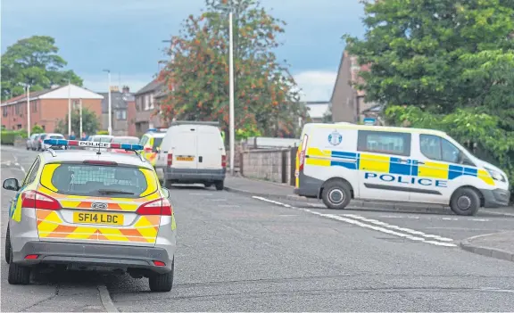  ?? Picture: Kim Cessford. ?? Police at the scene of the incident in Forfar, which one resident said involved “completely unacceptab­le behaviour”.
