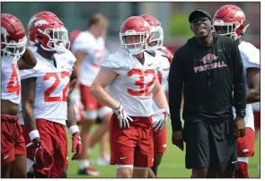  ?? (NWA Democrat-Gazette/Andy Shupe) ?? Arkansas running backs coach Jimmy Smith gives instructio­ns during practice earlier this month in Fayettevil­le. Smith and fellow Razorback assistants share Coach Sam Pittman’s recruiting tenacity and communicat­ion skills.