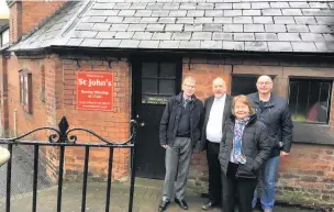  ??  ?? Churchward­en Ben Proctor, far left; Reverend Nigel Irons, organist Jean Scott and her husband Les, outside St John’s Church, Leek.