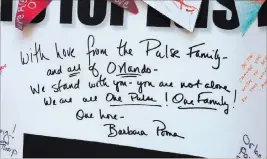  ??  ?? A handwritte­n note from Barbara Poma, owner of the Pulse Nightclub in Orlando, Fla., graces the panel that was sent to Las Vegas after the Oct. 1 shooting and is now part of the Hearts for Vegas display at Las Vegas City Hall.