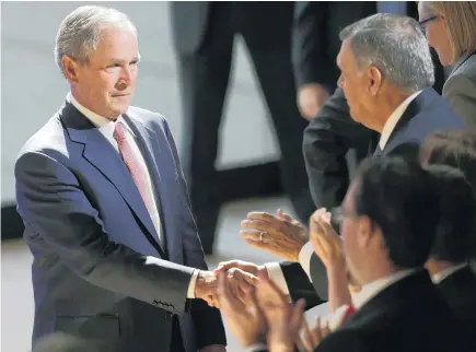  ?? Picture / AP ?? George W. Bush takes time to meet members of the audience after yesterday’s speech. Jonathan Lemire