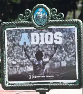  ?? Juan Mabromata / AFP via Getty Images ?? A view of a street banner bidding farewell to the late Argentine soccer legend Diego Maradona in Buenos Aires on Friday.