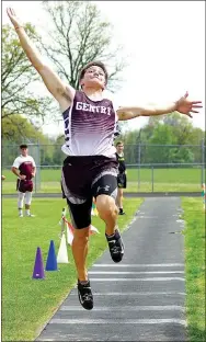  ?? Photo by Randy Moll ?? Gentry’s Cole Cripps took third in the long jump, clearing 20-O.3.56. He took first in the pole vault.