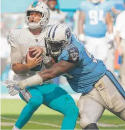  ?? | AP ?? Titans defensive end Jurrell Casey sacks Jay Cutler in the second half. Cutler’s six- yard pass to Jarvis Landry in the fourth quarter won it for the Dolphins.