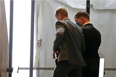  ?? STUART CAHILL PHOTOS / HERALD STAFF ?? AWAY HE GOES: Mayor Martin Walsh, right, and an aide leave the press conference on Thursday. Walsh answered no questions at the event. Left, Chief of Health and Human Services Marty Martinez looks over Walsh’s shoulder.