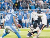  ?? CARLOS OSORIO/AP ?? Cairo Santos kicks the winining field goal as tim expires to lift the Bears over the Lions on Thanksgivi­ng in Detroit. The Lions remained winless this season.