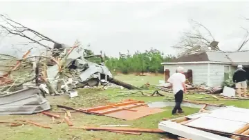  ?? — Reuters photo ?? Debris seen following a tornado in Beauregard, Alabama, US in this still image obtained from social media video.