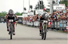  ??  ?? Anton Cooper, left, was pipped by Nino Schurter in the Czech Republic earlier this year.
