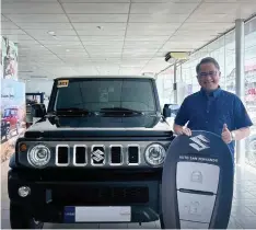  ?? (Photo courtesy of Suzuki San Fernando) ?? SET FOR A NEW ADVENTURE.
Businessma­n and off-roader Rene Romero with his new Suzuki 5-door.