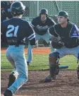  ??  ?? Royals catcher Leigh Ashmore poised to tag runner Jordan Baumann at home plate.