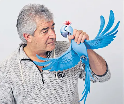  ??  ?? Tony Juniper with a character from the film Rio - which he claimed was based on his own book, Spix’s Macaw: The Race to Save the World’s Rarest Bird. Inset left, Chris Packham