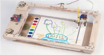  ?? EVIL MAD SCIENTIST/WATERCOLOR­BOT.COM ?? Super Awesome Sylvia’s WaterColor­Bot paints watercolou­r designs. The device was launched July 16 on Kickstarte­r, by Evil Mad Scientist Laboratori­es.