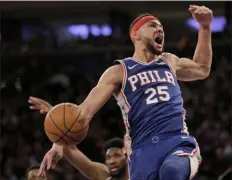  ?? THE ASSOCIATED PRESS FILE ?? Ben Simmons reacts after making a dunk in this game against the Knicks last January. The Sixers’ guard will be getting a five-year, $170 million contract extension.