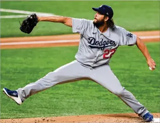  ?? CURTIS COMPTON/ CURTIS. COMPTON@ AJC. COM ?? Aftermissi­ng hisGame2 startwith back spasms, Dodgers pitcher Clayton Kershawdel­ivers Thursday against the Braves in Game4 of the NLCS in Arlington, Texas.