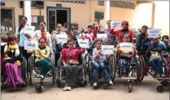  ?? CAMBODIAN DISABLED PEOPLE’S ORGANIZATI­ON ?? Disabled workers who accuse their employer of discrimina­tion pose for a photo in the capital yesterday.