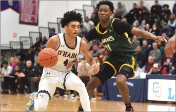 ?? PETE BANNAN — MEDIANEWS GROUP ?? O’Hara’s Isaiah Pasha, left, in action against Bonner & Prendergas­t earlier this season, scored 23 points to lead the Lions over Fleetwood in the opening round of the PIAA Class 4A Tournament.