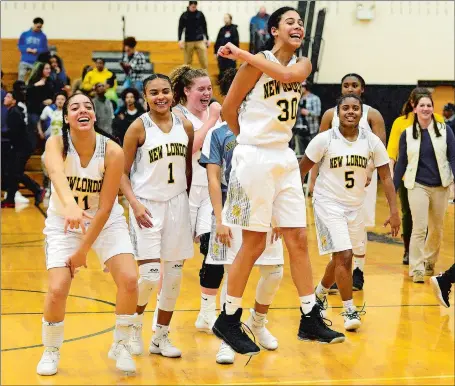  ?? SARAH GORDON/THE DAY ?? New London’s Taina Pagan (30) leads the celebratio­n after the top-seeded Whalers defeated No. 2 NFA 57-28 at Plainfield High School to win their second straight Eastern Connecticu­t Conference Division I tournament title Wednesday night.