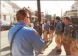  ?? DIGITAL FIRST MEDIA FILE PHOTO ?? A Pottstown Police Officer trying to move a crowd of Pottstown Middle School students along down North Franklin after school got some back-talk from some of the students.