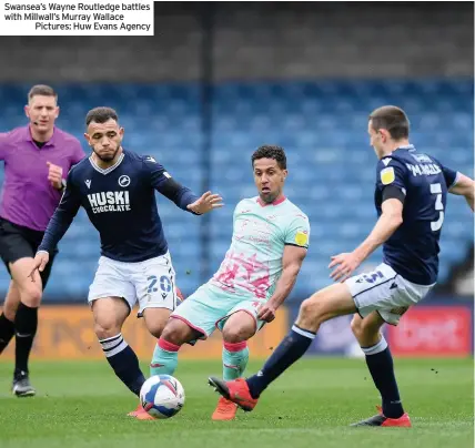  ??  ?? Swansea’s Wayne Routledge battles with Millwall’s Murray Wallace
Pictures: Huw Evans Agency